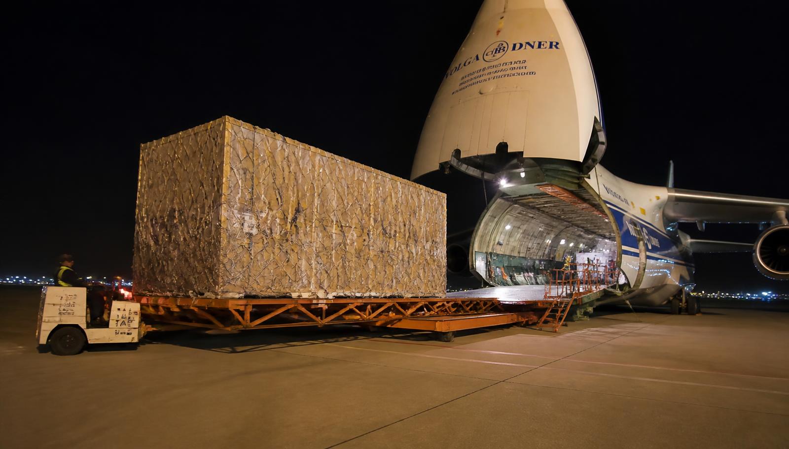 Heavy cargo being loaded onto a freight aircraft for an international consignment